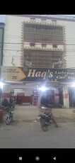 SECTOR 15/B COMMERCIAL TWO SHOPS ALONG WITH G+2 HOUSE ON MAIN DIVIDING 200 FT WIDE ROAD 15-B AND 15-A-4 RENTAL INCOME 2.50 LAC BUFFERZONE
