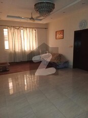 Sophisticated 1-Kanal Bungalow with 5 Beds, 2 Kitchens, and Powder Room in DHA Phase 1 Block D Perfect for Entertaining DHA Phase 1 Block D